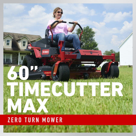 Person operating a Toro Timecutter Max zero turn mower in a residential yard.