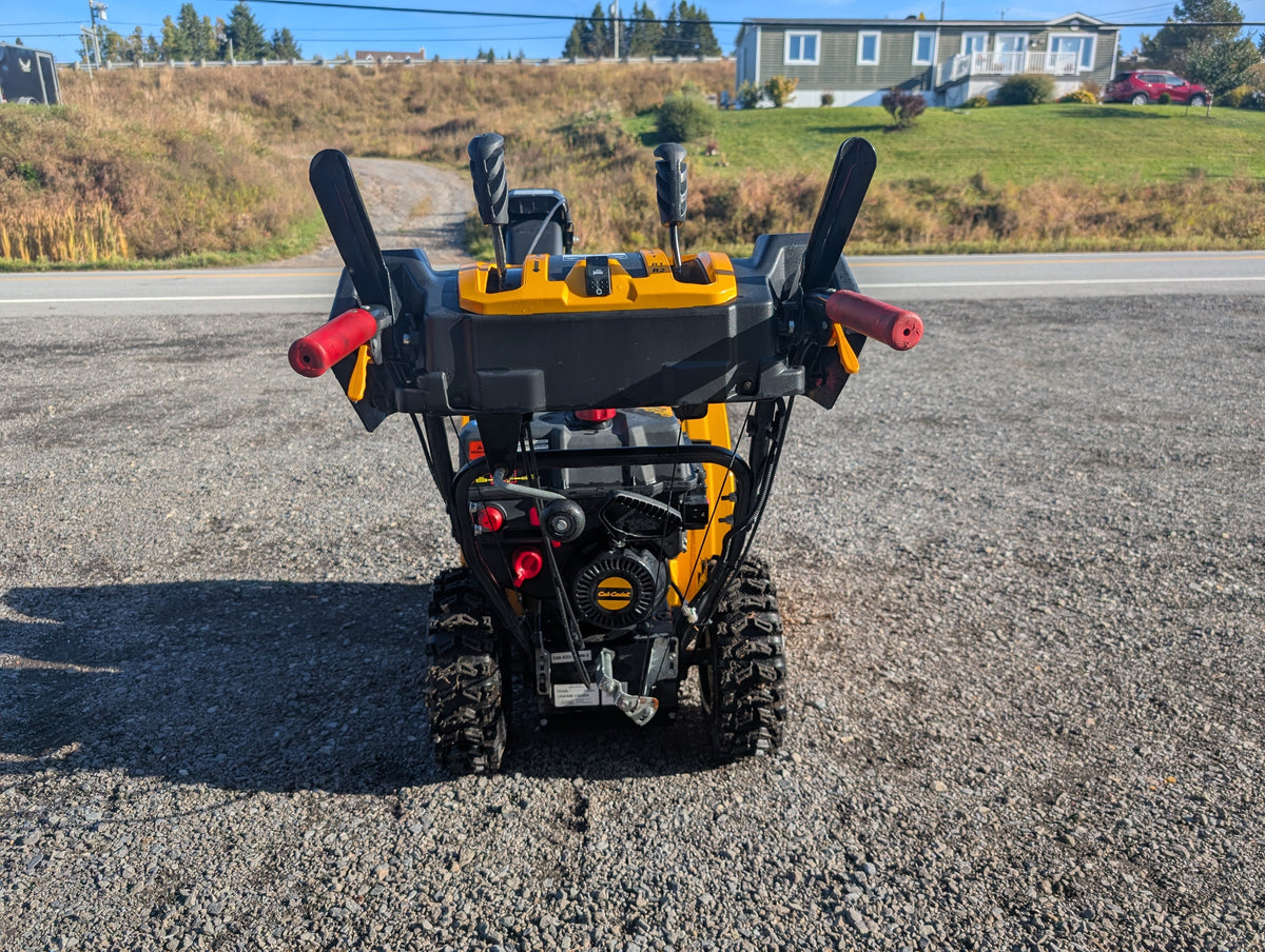 Operator controls with heated grips and trigger steering