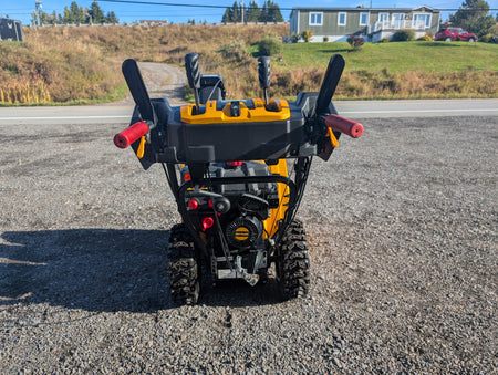 Operator controls with heated grips and trigger steering