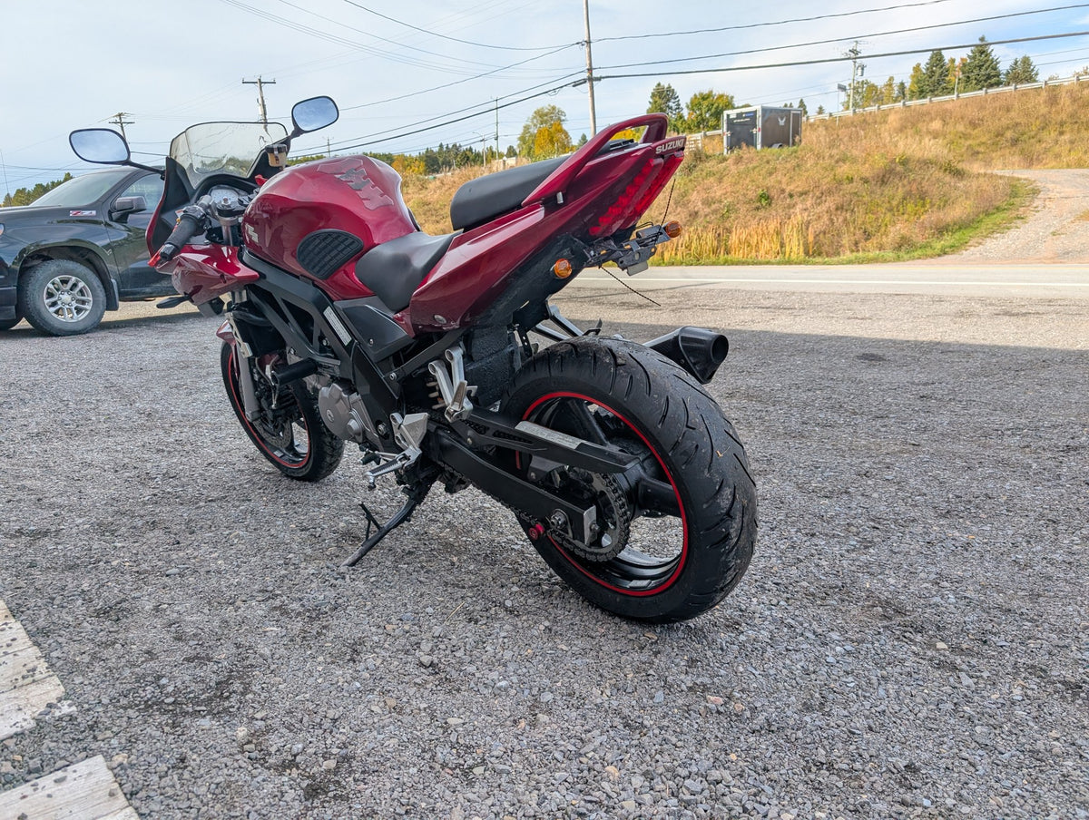 Rear left view of the red 2007 Suzuki SV650S