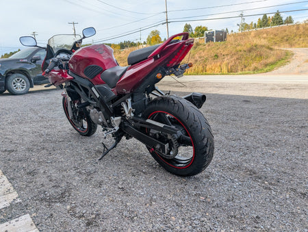 Rear left view of the red 2007 Suzuki SV650S